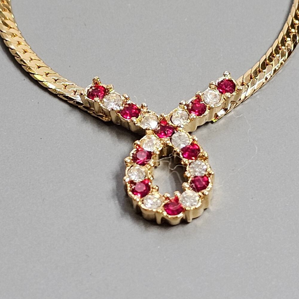 AVON THE PLAZA Necklace Simulated Ruby Infinity Loop Goldtone 19in 1988 Vintage